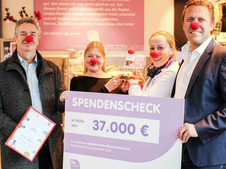 Lila Bäcker spendet für Rote Nasen Clowns